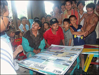 Local villagers looking at map