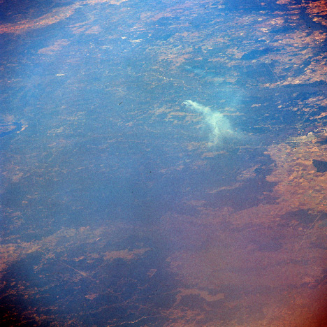 Photograph of a lumber mill smoke plume from Gemini VII.