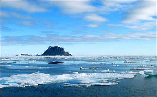 Photograph of sea ice, clouds, and open water in the Arctic Ocean