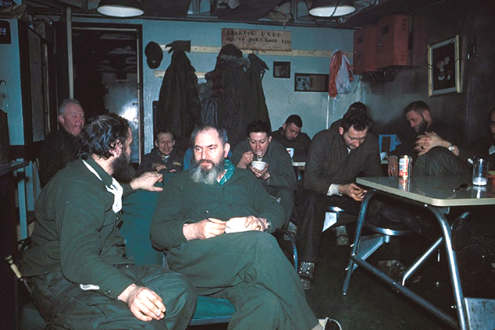 Scientists enjoying ice cream and a movie at the South Pole station.'