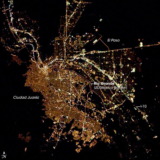 El Paso, Texas and Juaréz Mexico at night. Photograph taken from the International Space Station.