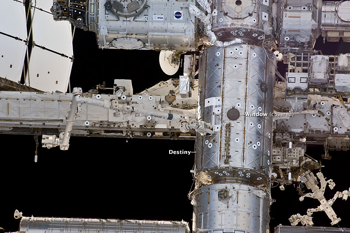 Astronaut photograph of the Earth-facing side of the Destiny module aboard the ISS.