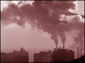 Photograph of factory smokestacks emitting smoke