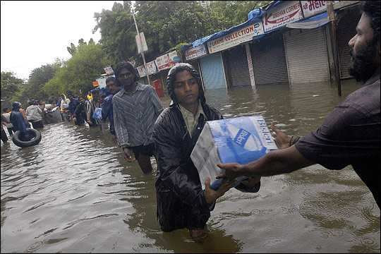 Photograph of relief workers after Mumbai floods in 2005.