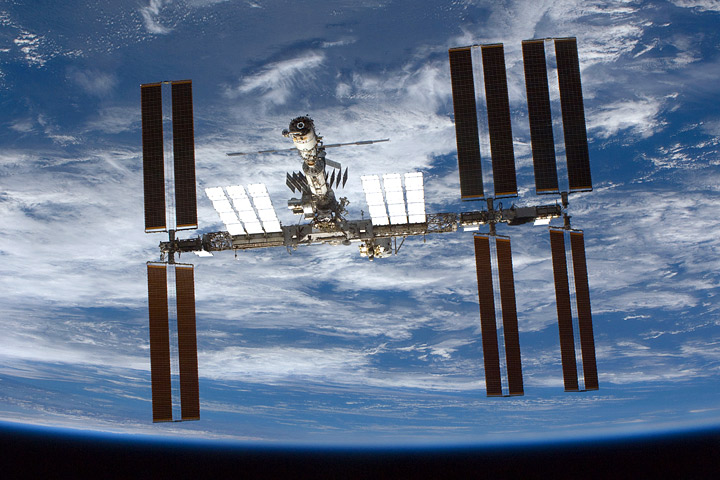 Photograph of the International Space Station orbiting above the Earth.