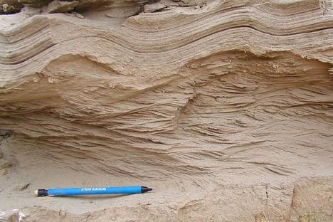 Photograph of sand deposits from historical flooding on the Indus River.