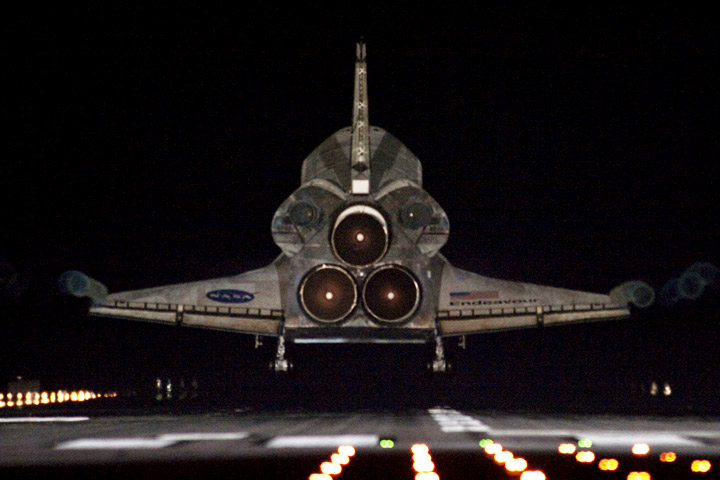 Space shuttle Endeavour approaches Runway 15 on the Shuttle Landing Facility at Kennedy Space Center.