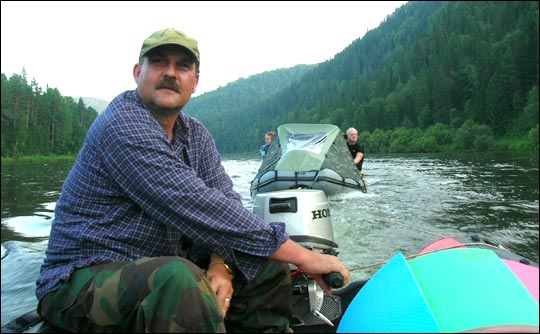 Photograph of Dr. Jon Ranson on a boat