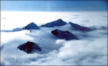Photograph of Arctic Mountains above the Cloud Layer