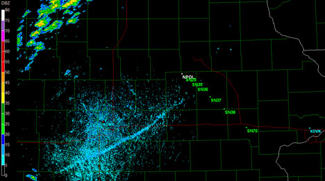 NPOL radar view of the "fine-line." Clouds and rain are shown in blue. The line of green sites show where the ground instruments are located. Credit: NASA