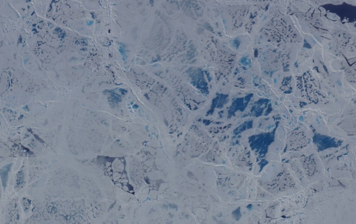 A camera on the MABEL instrument captured shots of cracked sea ice, dotted with melt ponds, during a flight to the North Pole. (Credit: NASA)