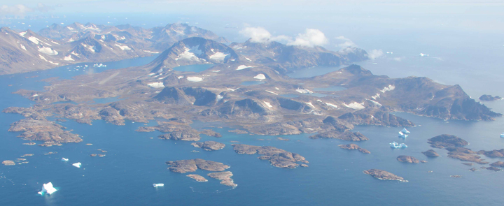 View of the Kulusuk Island from the air. At the left you can see the airport runway and on the right, you might be able to spot the DYE-4 station.